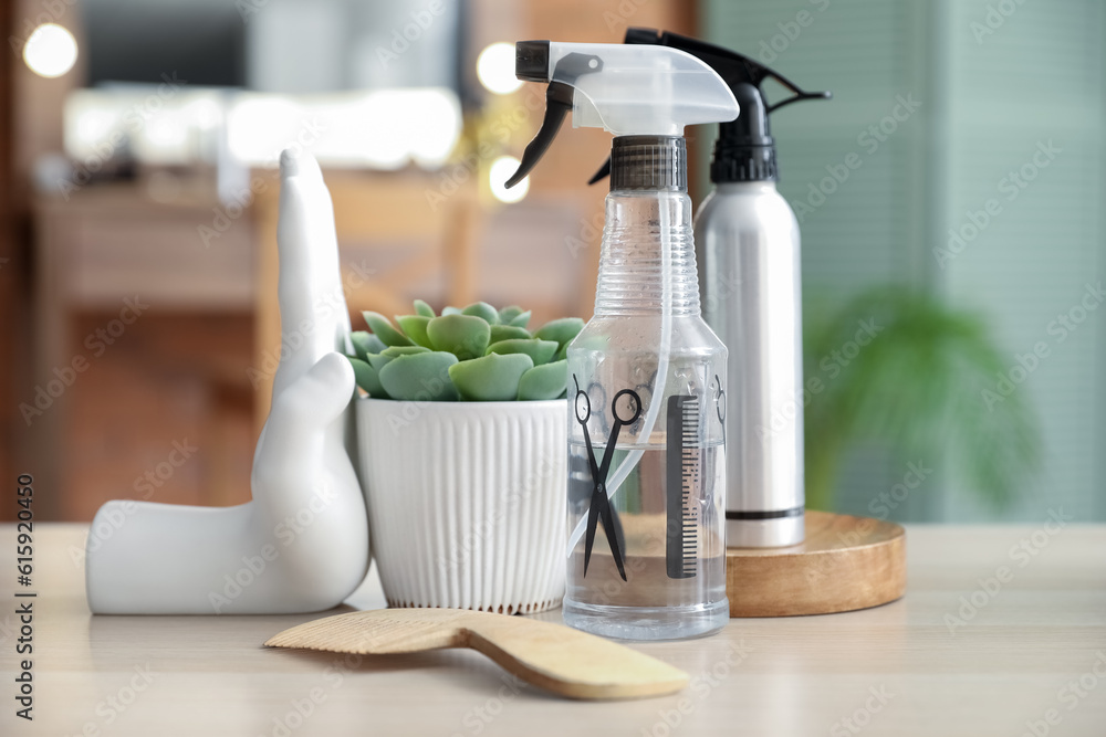 Different hairdressing tools on table in beauty salon