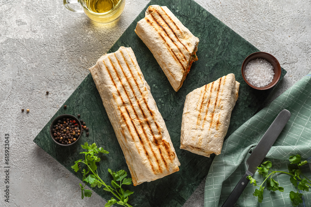 Board of tasty shawarma on grey table