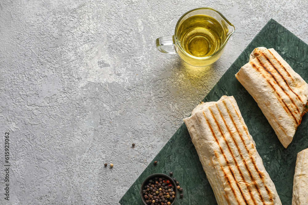 Board of tasty shawarma on grey table