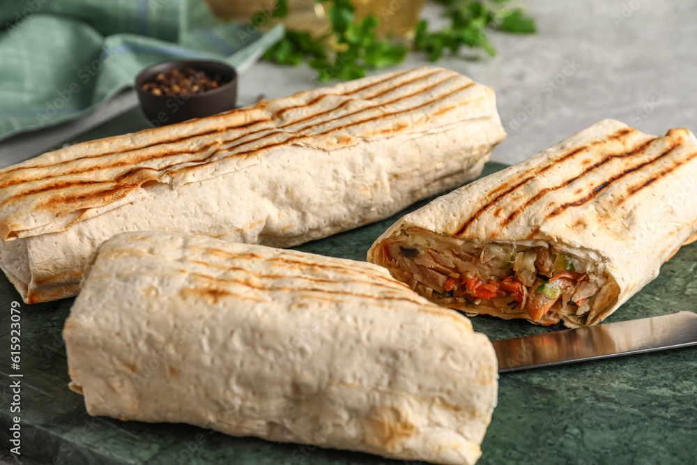 Board of tasty shawarma on grey table, closeup