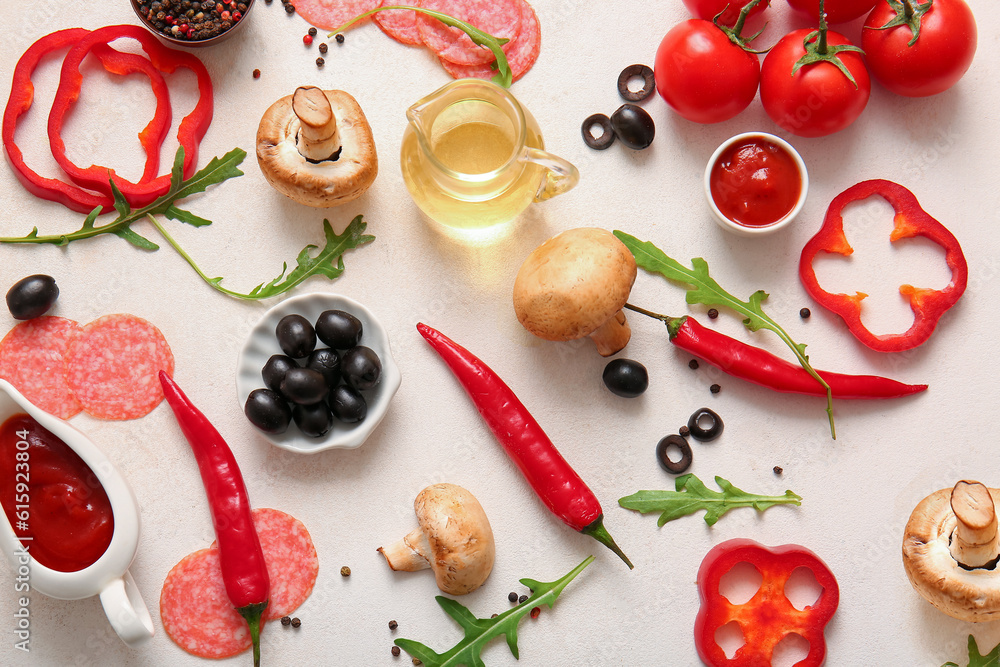 Different ingredients for preparing pizza on light background