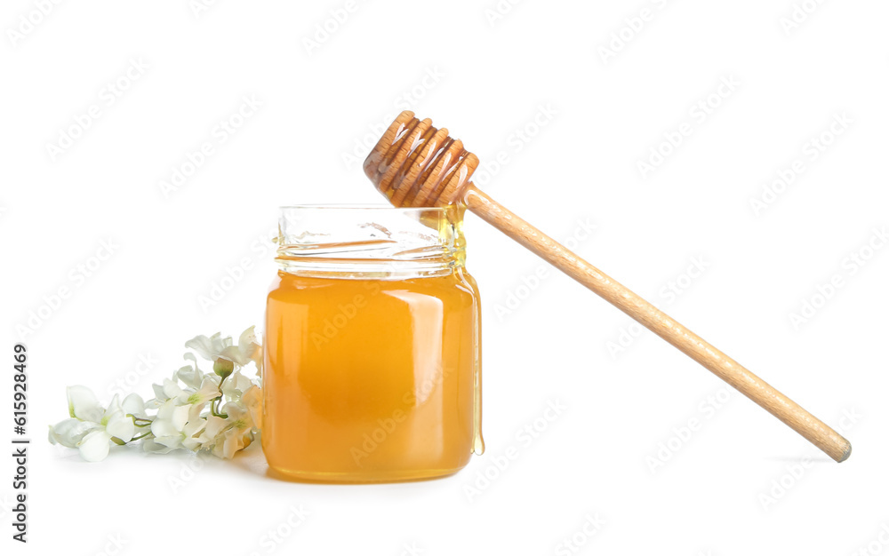 Jar of honey with flowers of acacia on white background