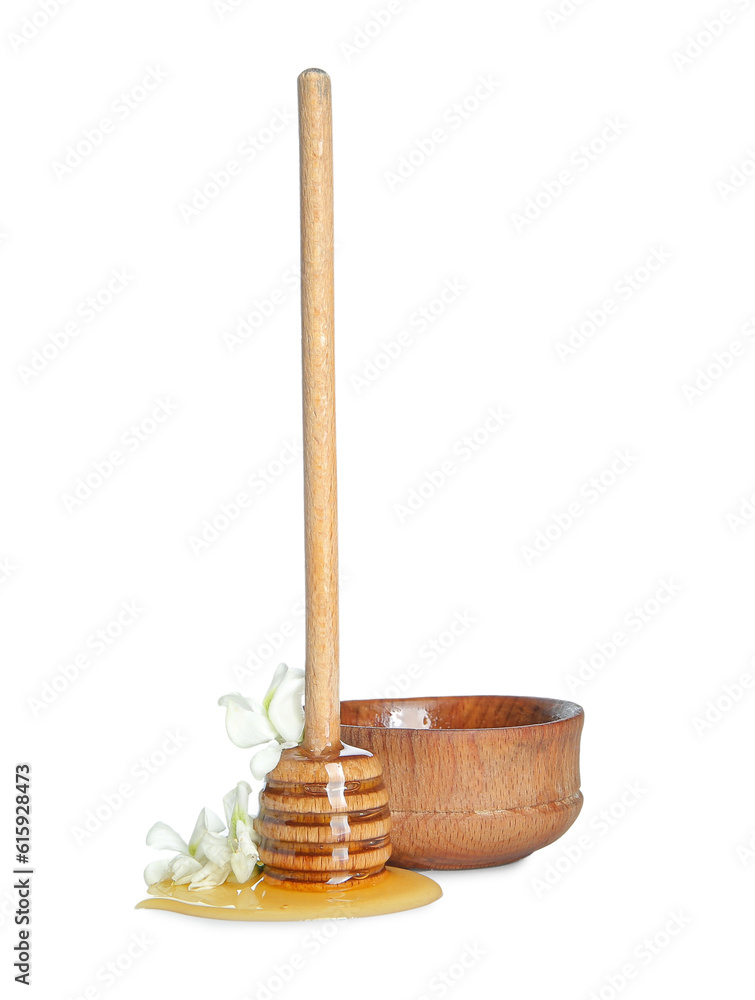 Bowl of acacia honey and dipper on white background