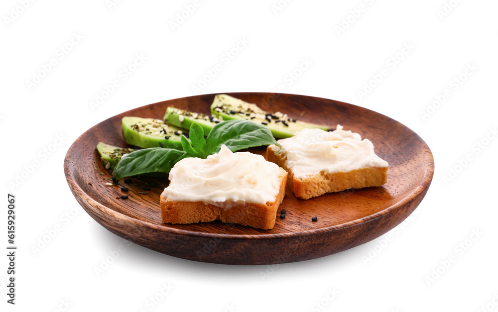 Plate of tasty croutons with cream cheese and avocado on white background