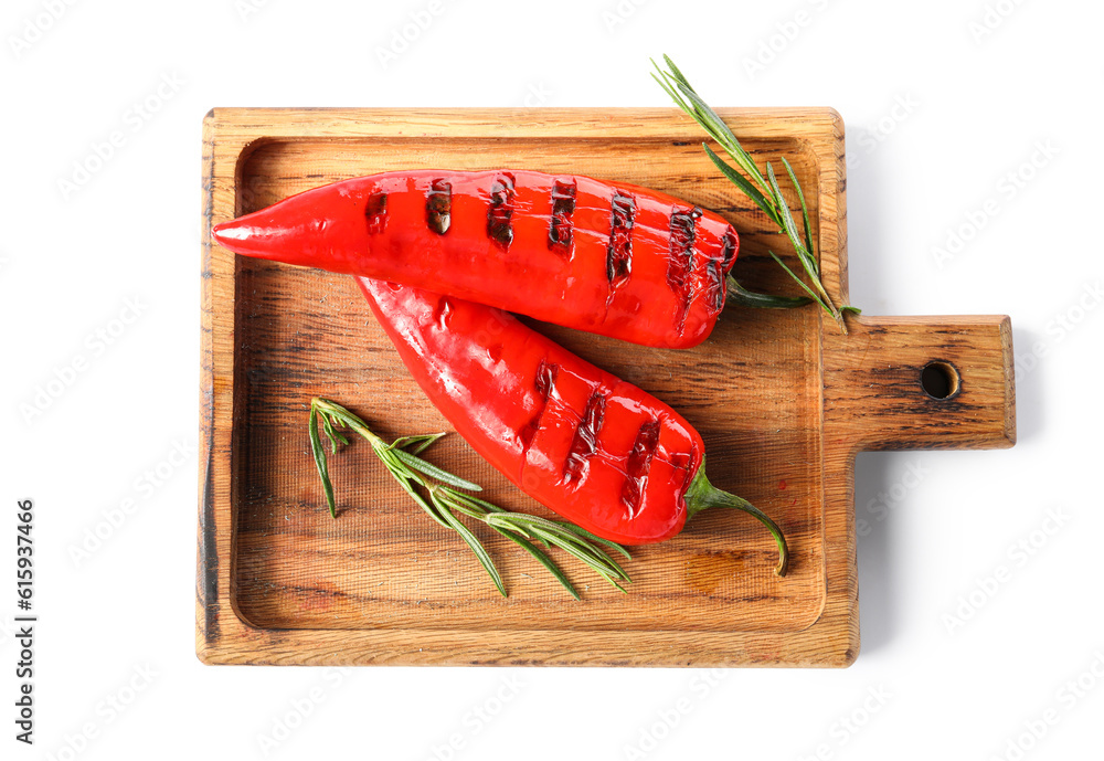 Wooden board of tasty grilled chili peppers isolated on white background