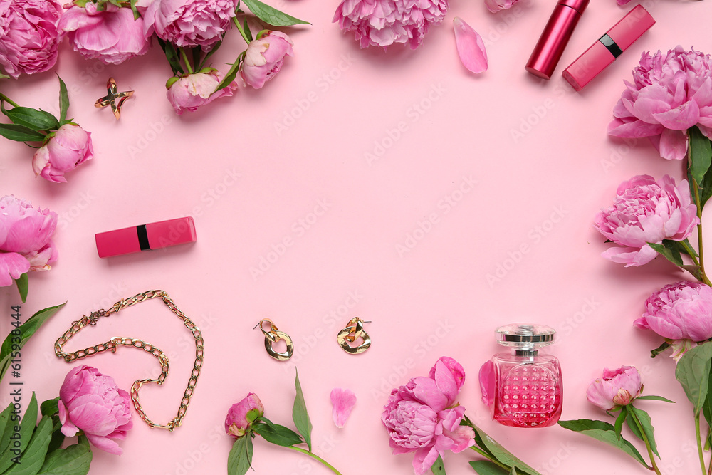 Frame made of stylish female accessories, cosmetics and beautiful peony flowers on pink background