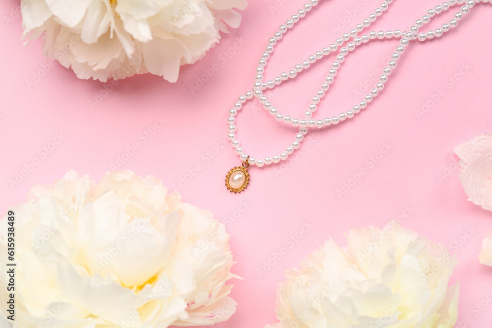 Composition with beautiful female necklace and white peony flowers on pink background