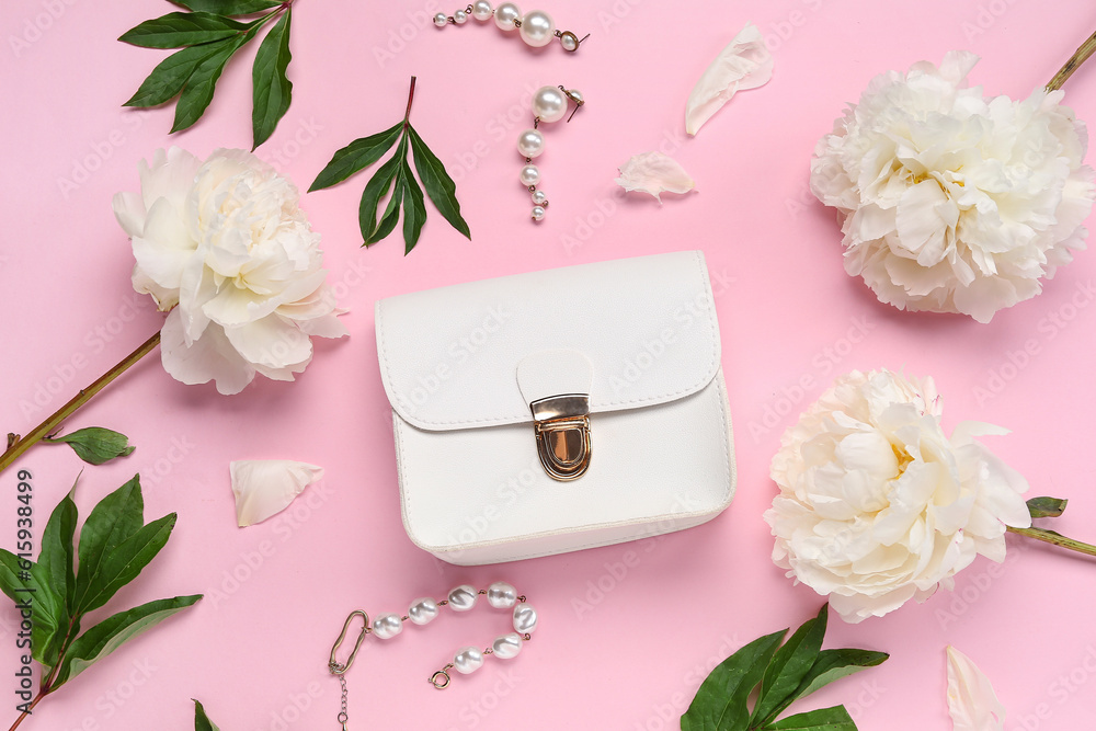 Composition with beautiful female accessories, bag and peony flowers on pink background