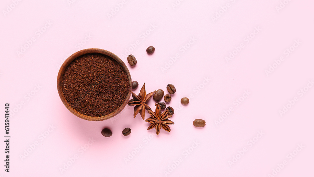 Bowl with coffee powder and star anise on pink background