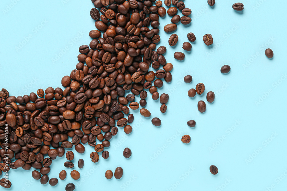 Frame made of coffee beans on blue background