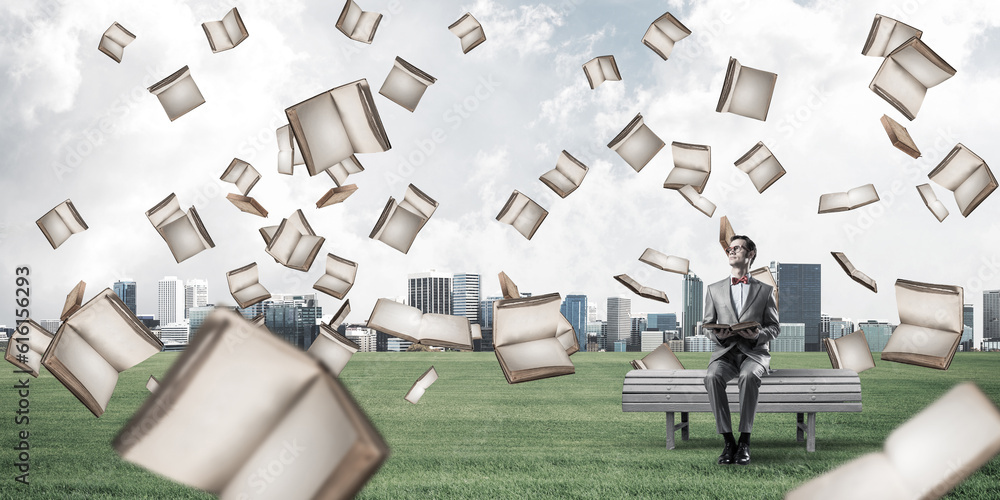 Young businessman or student studying the science in summer park