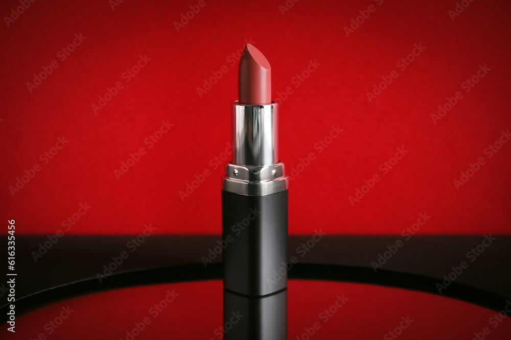 Red lipstick on color background