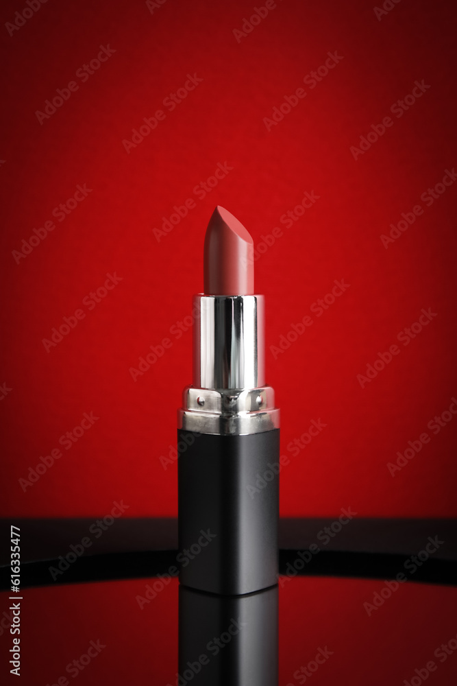 Red lipstick on color background