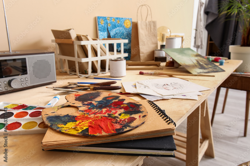 Table with artists supplies in studio