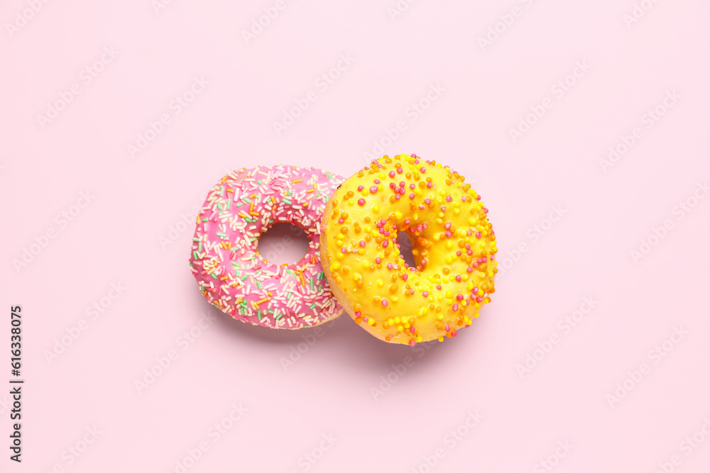 Sweet donuts on pink background