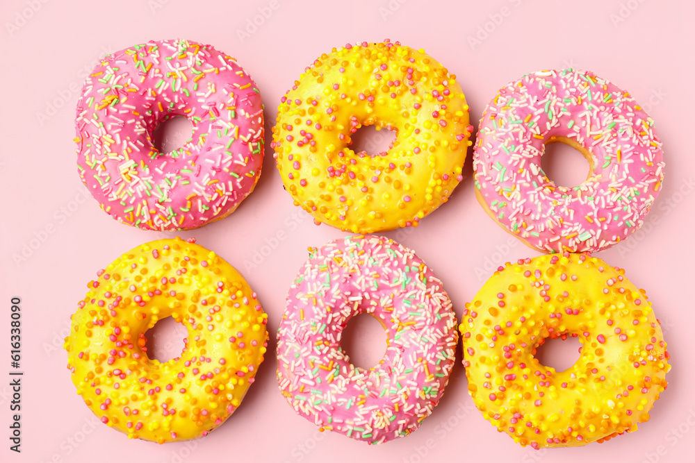 Sweet donuts on pink background