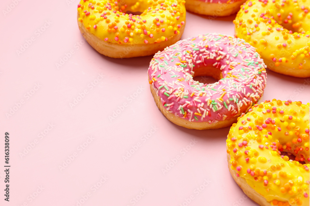 Sweet donuts on pink background