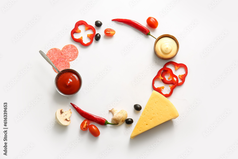 Frame made of ingredients for preparing pizza on white background