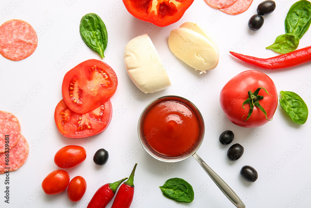 Fresh ingredients for preparing pizza on white background