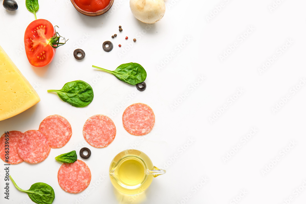 Fresh ingredients for preparing pizza on white background