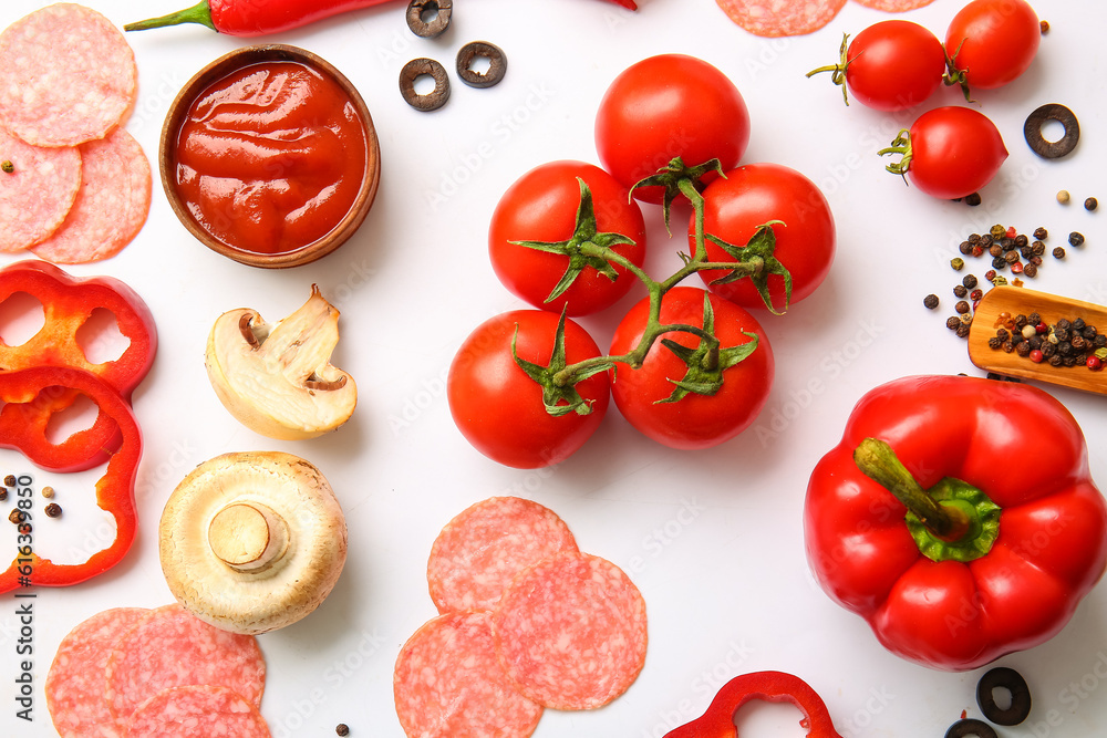 Fresh ingredients for preparing pizza on white background