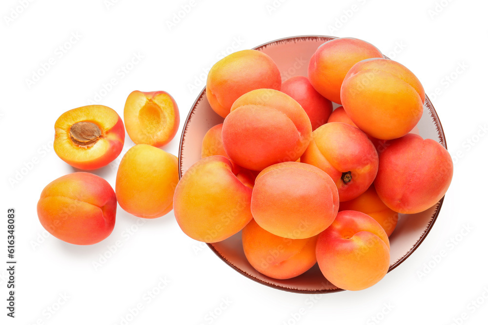 Bowl with ripe apricots isolated on white background