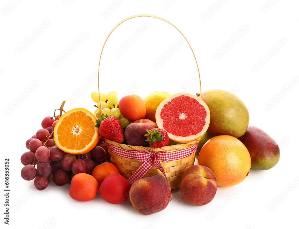 Wicker basket with different fresh fruits on white background