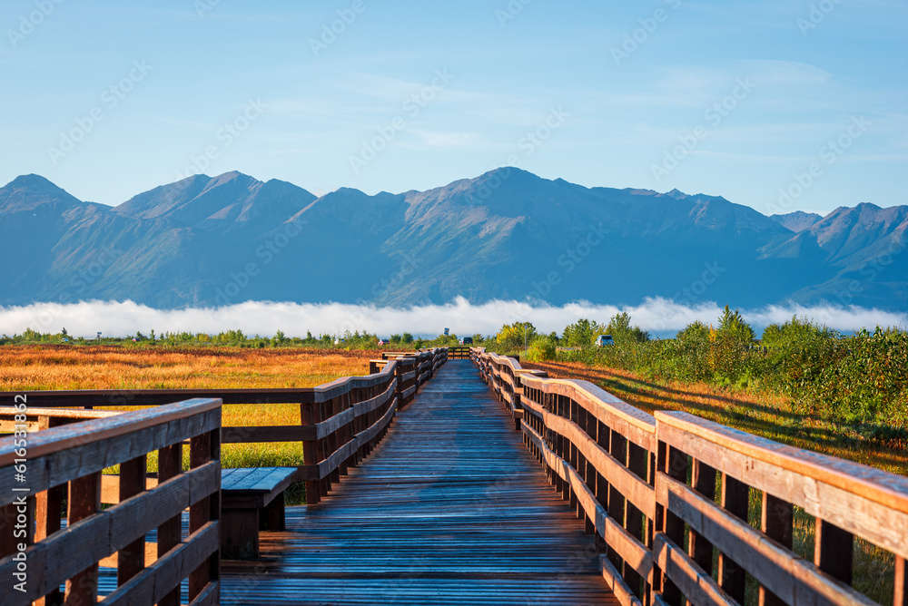 A wooden boardwalk in Potter Marsh Bird Sanctuary, Alaska.