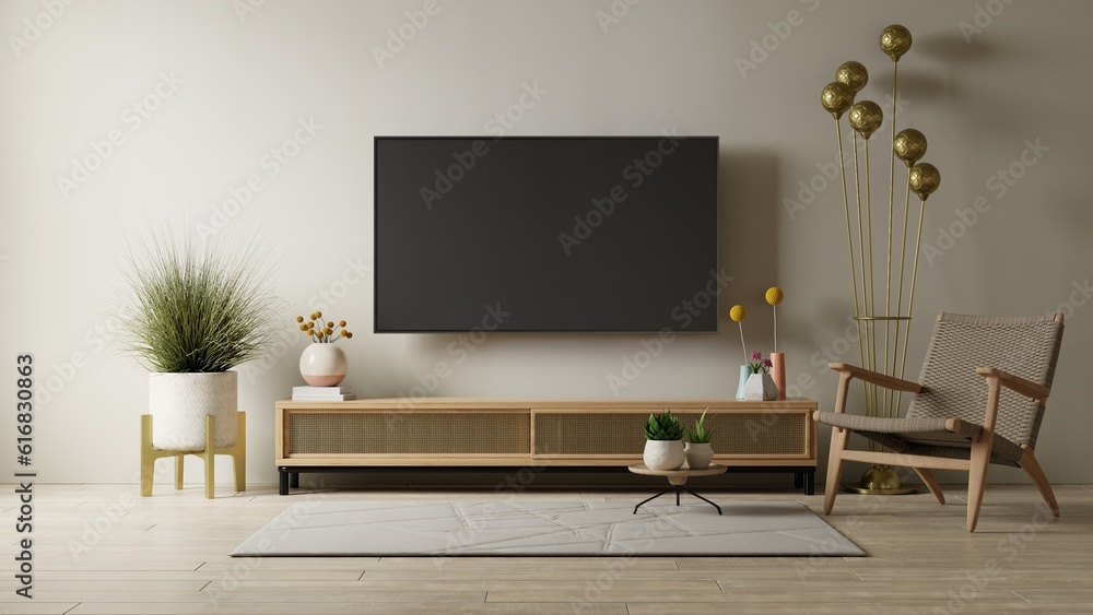 Mockup a cabinet TV wall mounted with armchair in living room with a cream color wall.