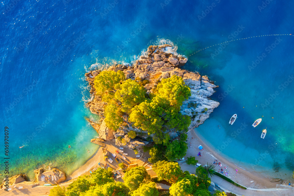 View from the air on the waves and rocks. Sea relaxation and travel. The forest near the sea. Azure 