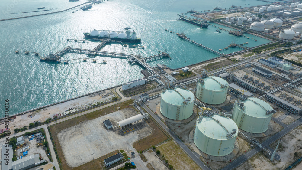 LNG (Liquified Natural Gas) tanker anchored in Gas terminal gas tanks for storage. Oil Crude Gas Tan