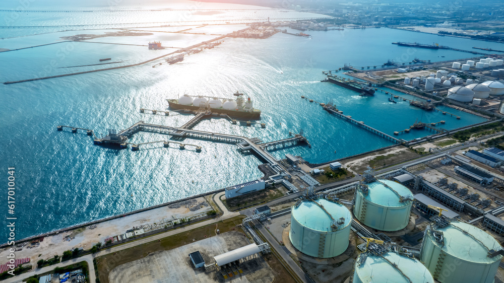 LNG (Liquified Natural Gas) tanker anchored in Gas terminal gas tanks for storage. Oil Crude Gas Tan