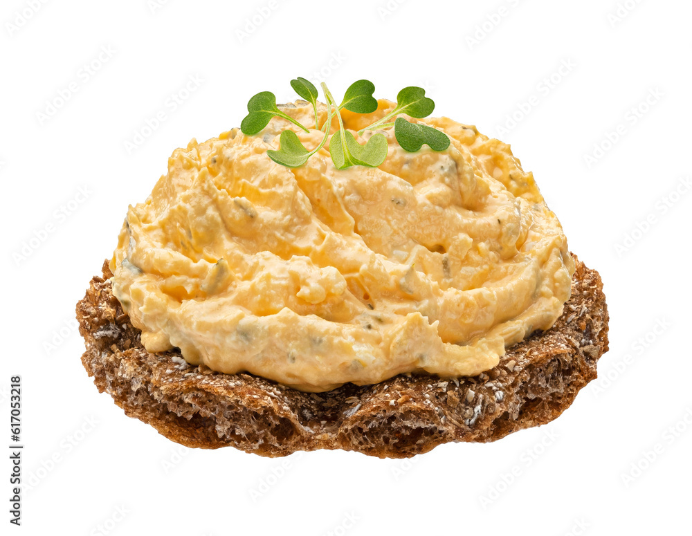 Egg spread with onion and chives on rye crispbread isolated on white background