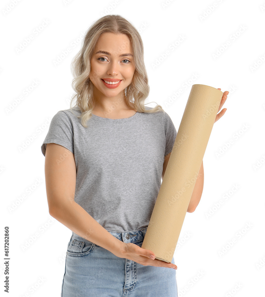 Young woman with wallpaper roll on white background