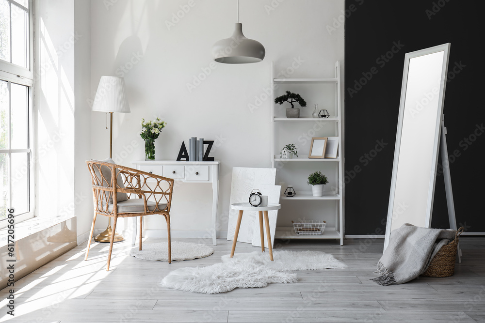 interior of living room with tables, armchair and shelving unit