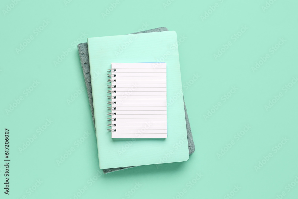 Set of notebooks on color background