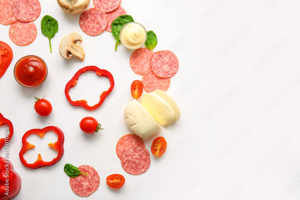 Fresh ingredients for preparing pizza on white background