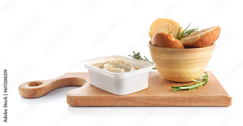 Plastic container with tasty cream cheese and bread on white background