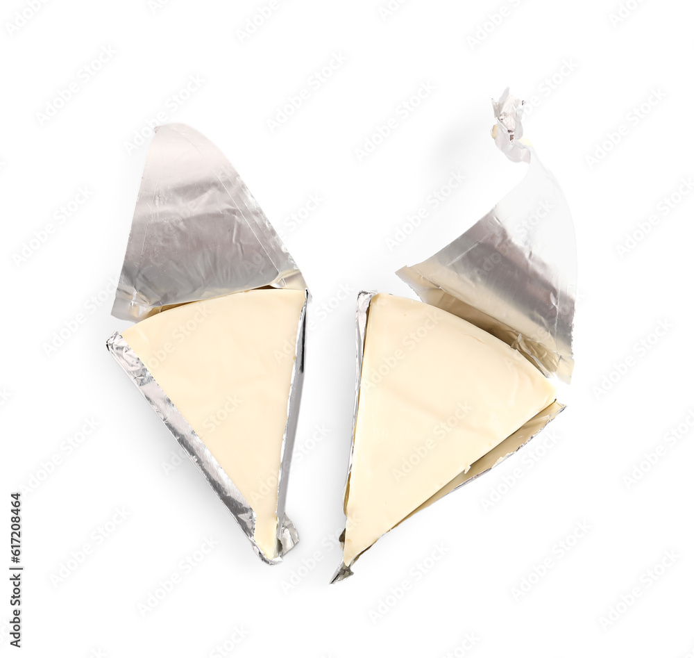 Triangles of tasty processed cheese on white background