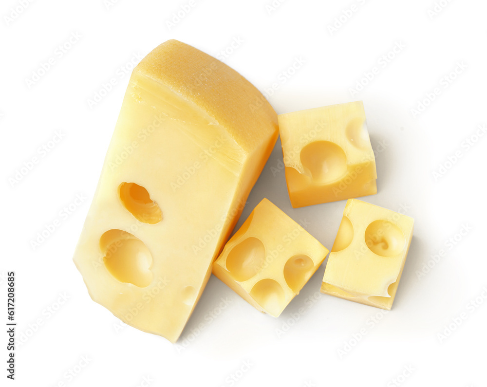 Piece and cubes of Swiss cheese on white background