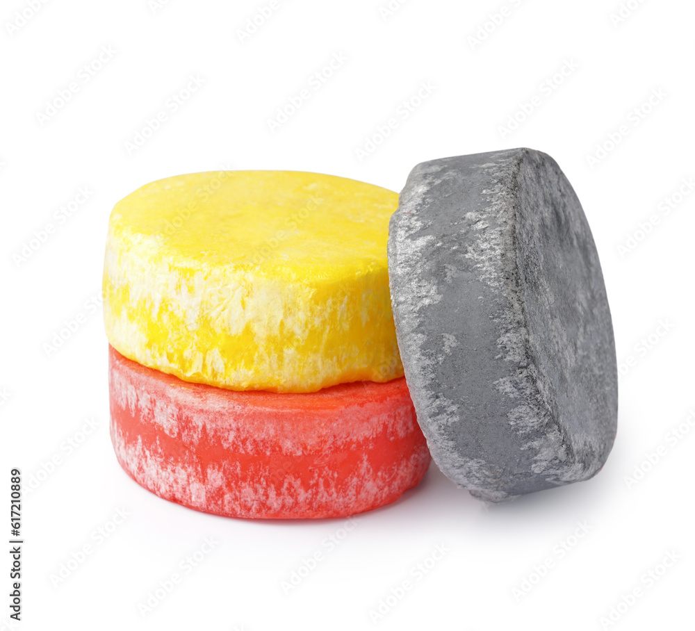 Colorful solid shampoo bars on white background