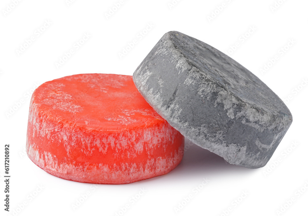 Colorful solid shampoo bars on white background