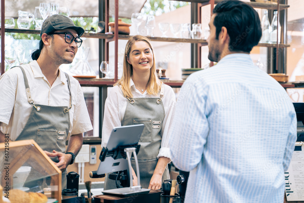 Caucasian attractive man receive hot coffee from waiter in coffee house. 