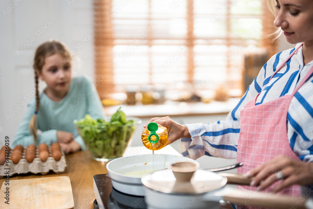 Attractive Caucasian family wear apron, cook foods in kitchen at home. 