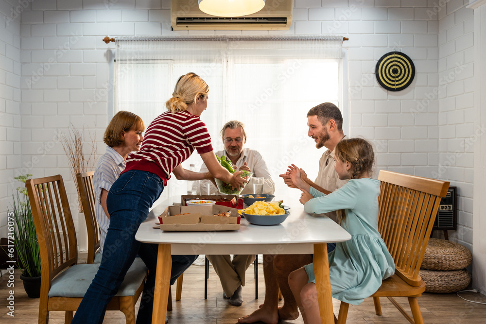 Caucasian lovely family having dinner, enjoying evening party in house. 