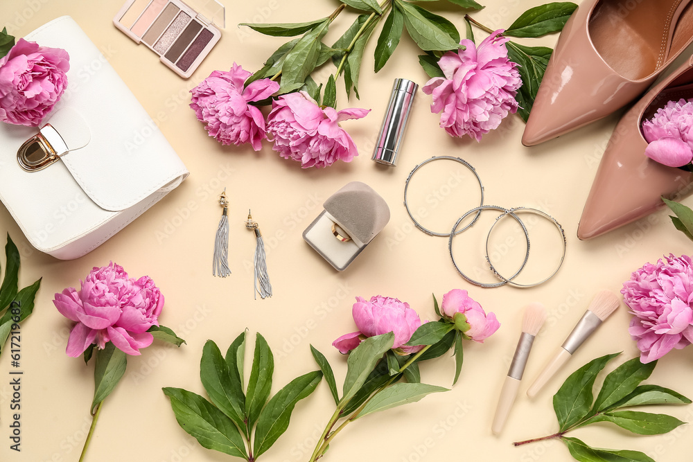 Composition with beautiful engagement ring, stylish accessories, cosmetics and peony flowers on colo