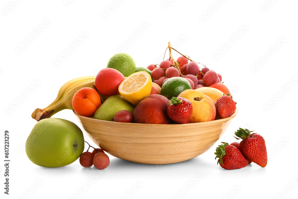 Bowl with different fresh fruits on white background