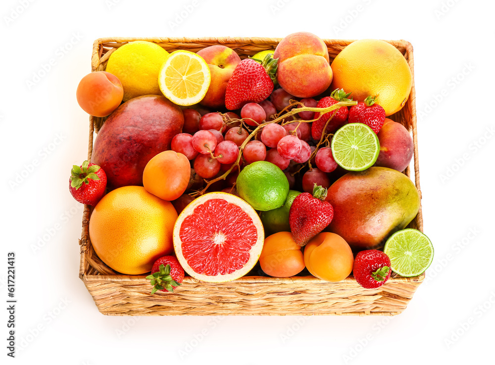 Wicker basket with different fresh fruits on white background