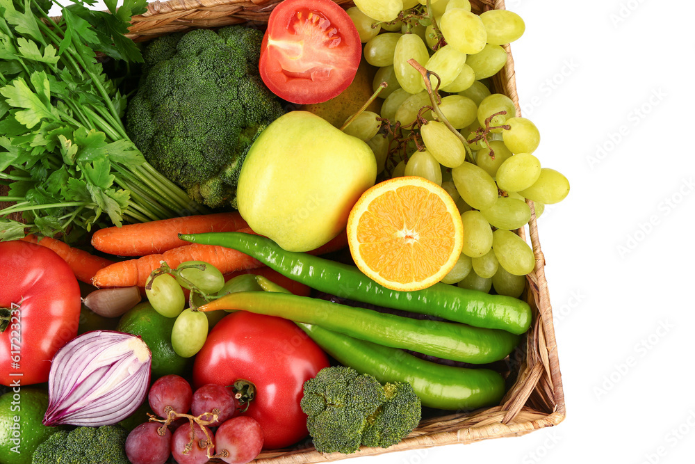 Wicker box with different fresh fruits and vegetables on white background, closeup