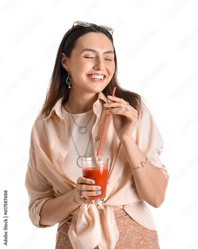 Young woman with glass of vegetable juice on white background